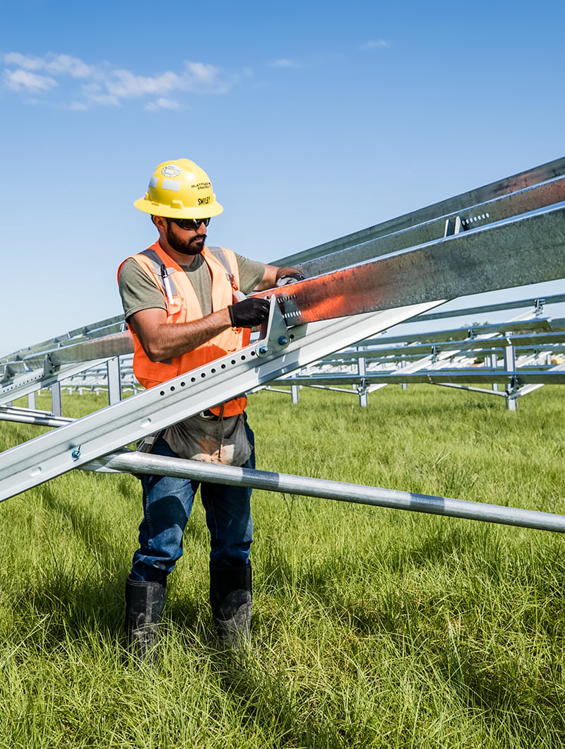 Employee working on solar grid